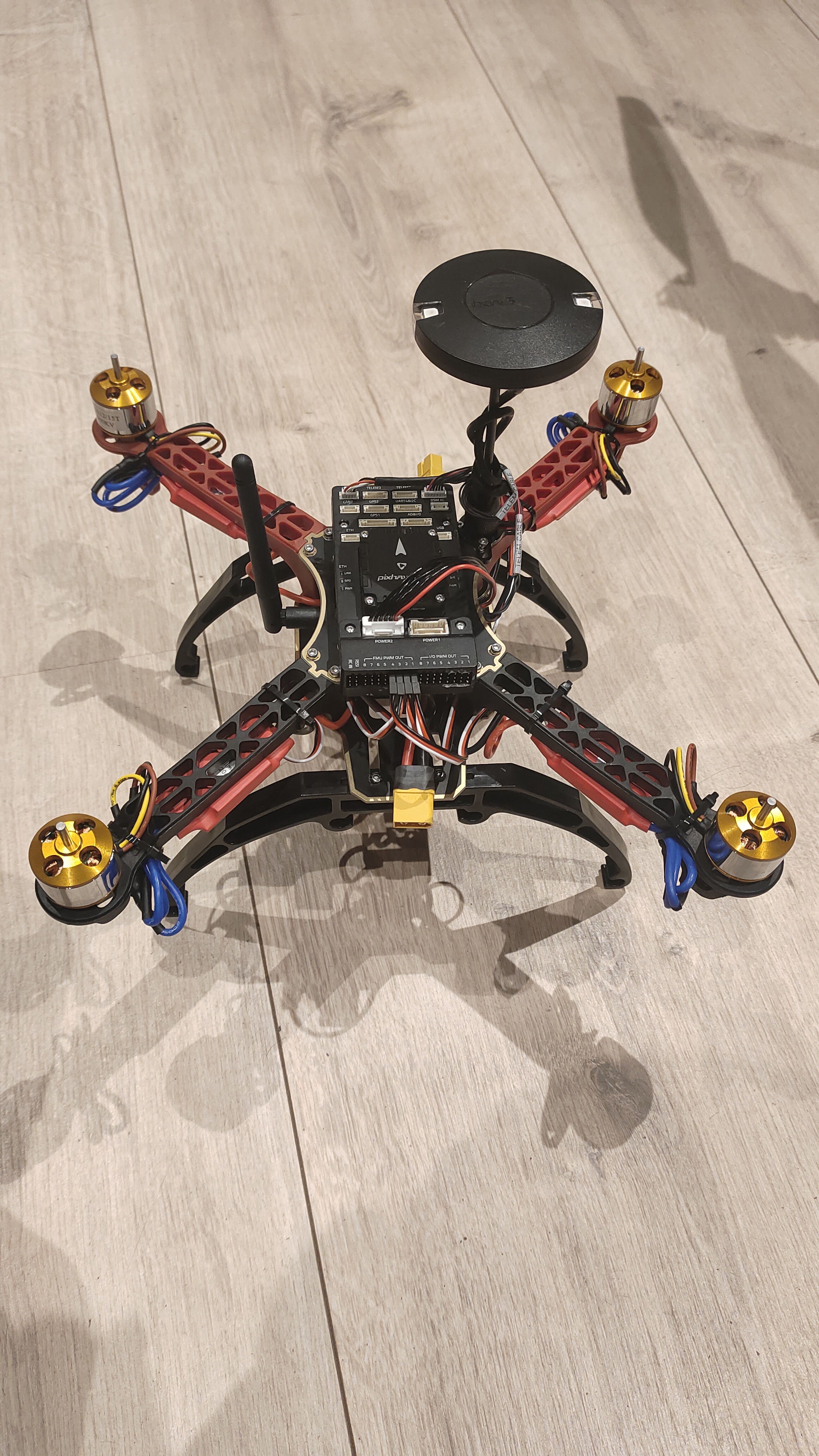 Fully assembled quadrotor with Pixhawk 5X, GPS mast, and landing gear